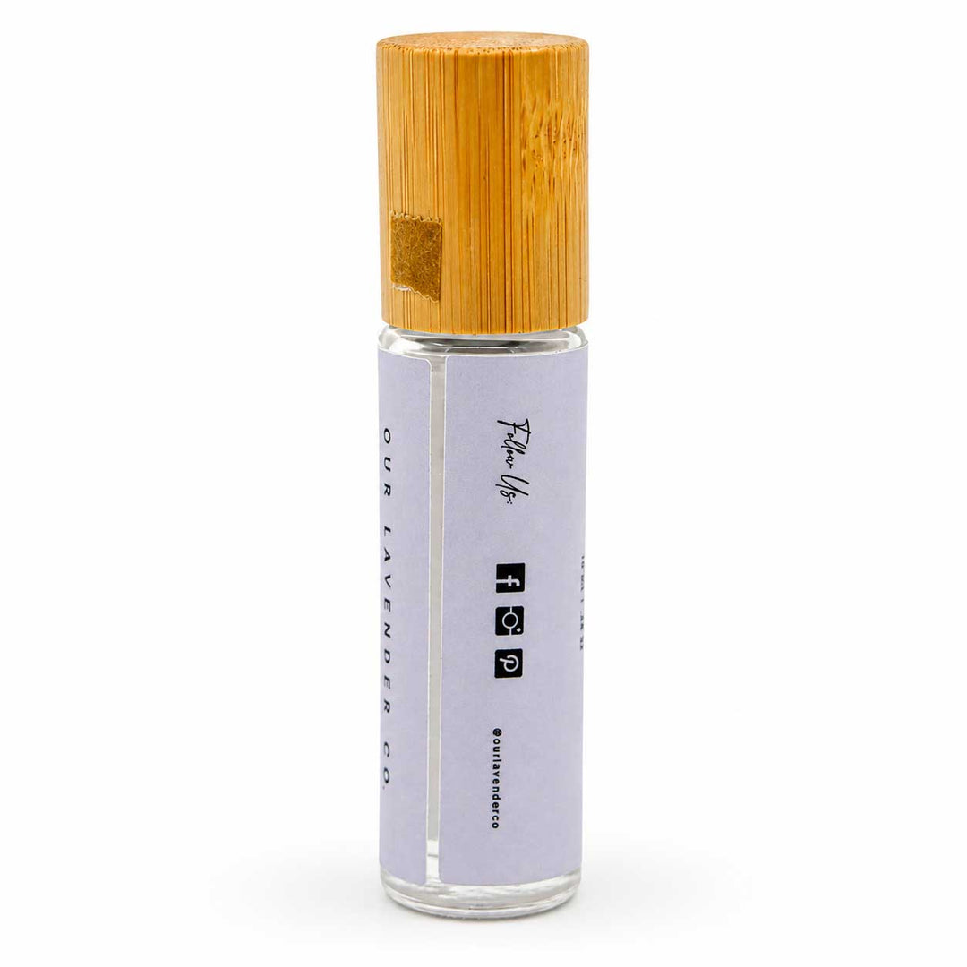 Roll-on bottle with wooden cap on a white background