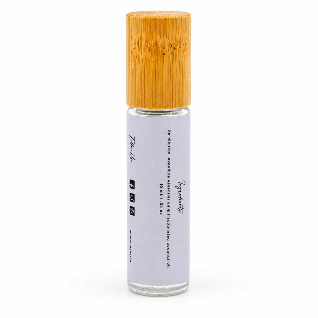 Roll-on bottle with bamboo cap on a white background