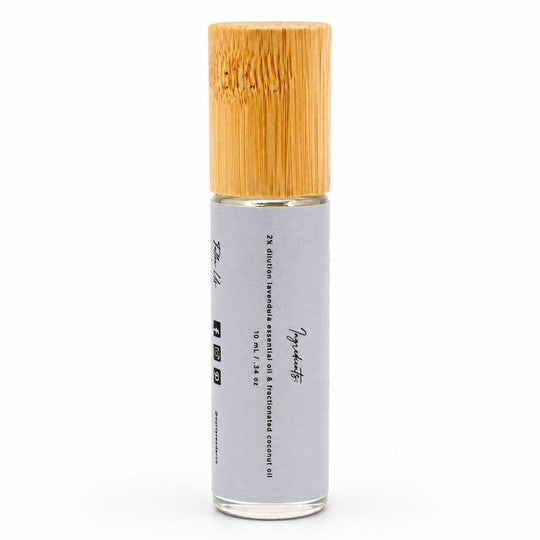 Roll-on bottle with bamboo cap on a white background