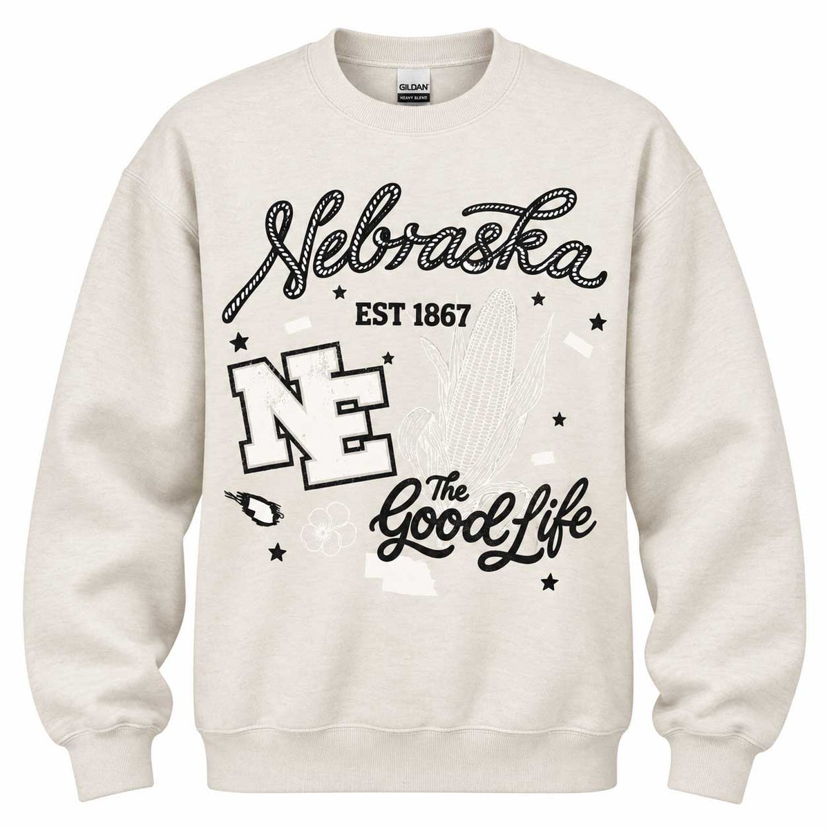 An off-white crewneck sweatshirt featuring a black graphic print on the front with the words 'Nebraska', 'EST 1867', 'NE', and 'The Good Life', along with a Nebraska Cornhuskers mascot silhouette.