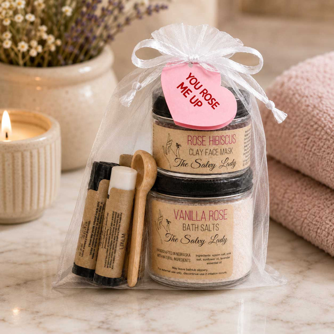 Rose facial set in bathroom with candle and towel.