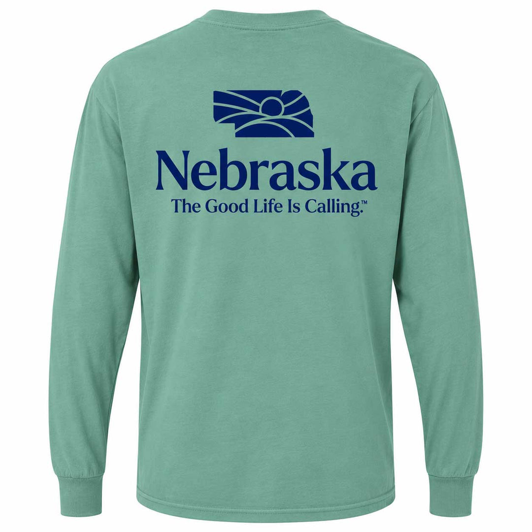A mint green long-sleeve t-shirt shown from the back, featuring a dark blue graphic of the Nebraska state silhouette and the text 'Nebraska The Good Life Is Calling' printed on the center back.