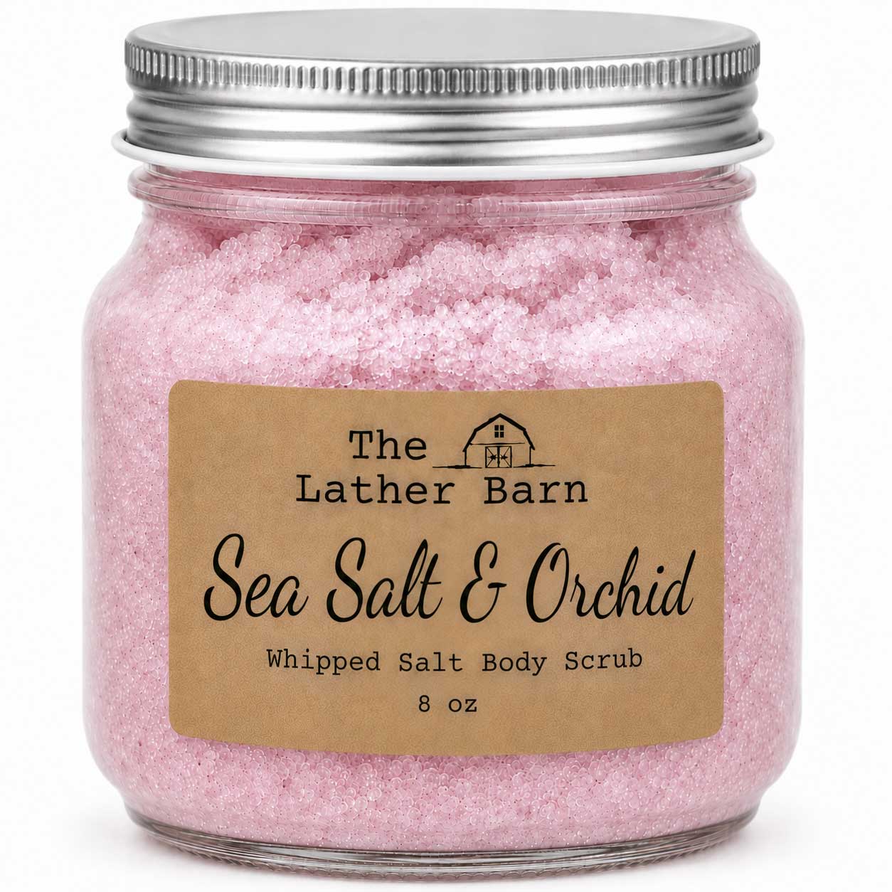 A clear glass jar filled with pink whipped salt body scrub, sealed with a silver metal lid, and labeled 'The Lather Barn Sea Salt & Orchid Whipped Salt Body Scrub 8 oz' on a white background.