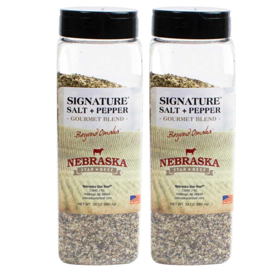 Two bottles of Nebraska Star Beef Signature Salt and Pepper on a white background
