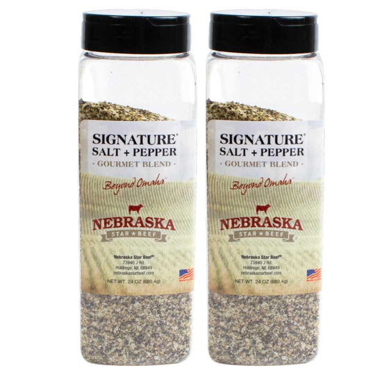 Two bottles of Nebraska Star Beef Signature Salt and Pepper on a white background