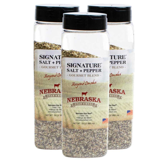 Three bottles of Nebraska Star Beef Signature Salt and Pepper on a white background