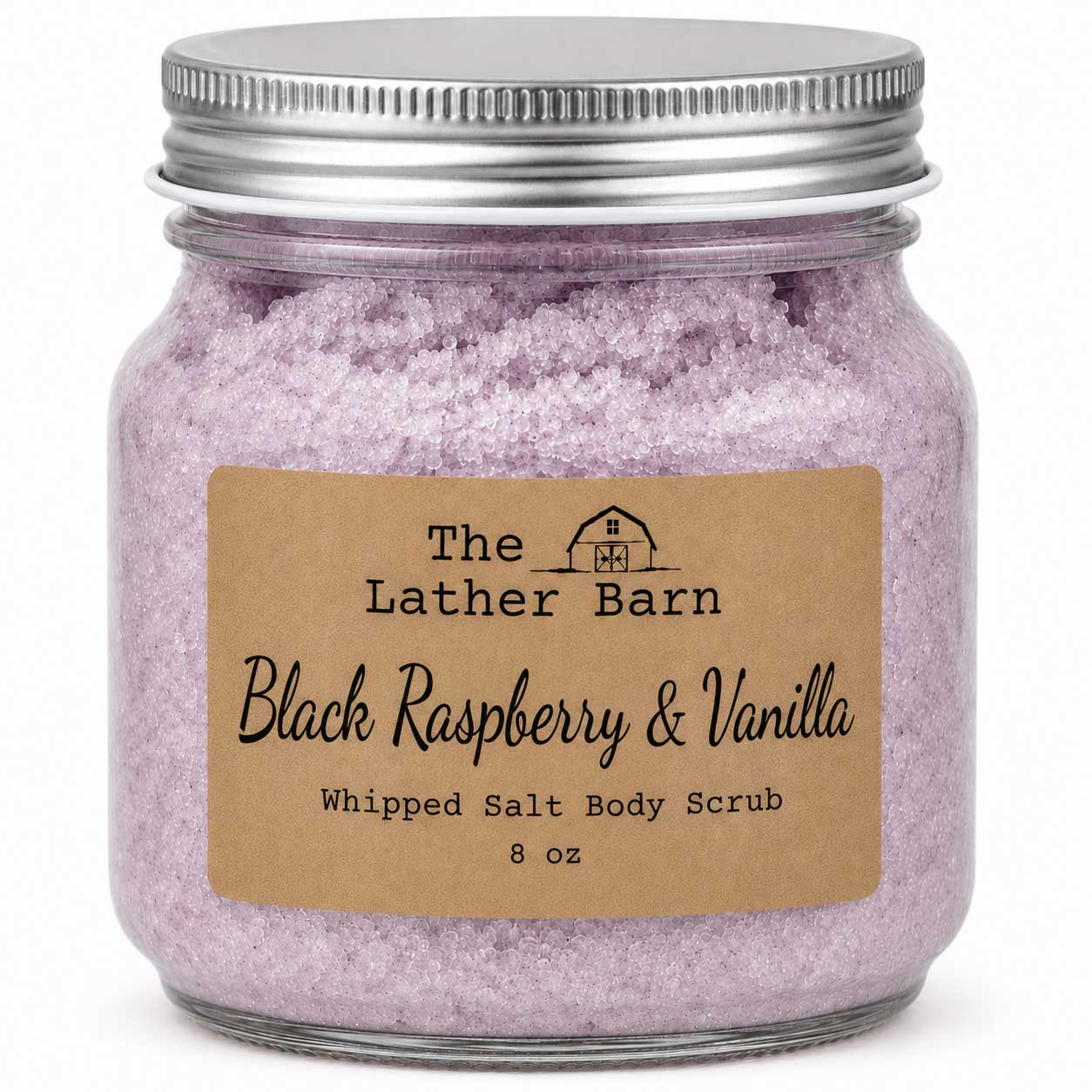 An 8 oz glass jar of whipped salt body scrub by The Lather Barn, featuring light purple-pink crystals and a brown kraft paper label, sealed with a silver metal lid.
