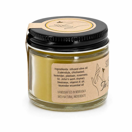 Jar of skincare product with black lid and label on a white background