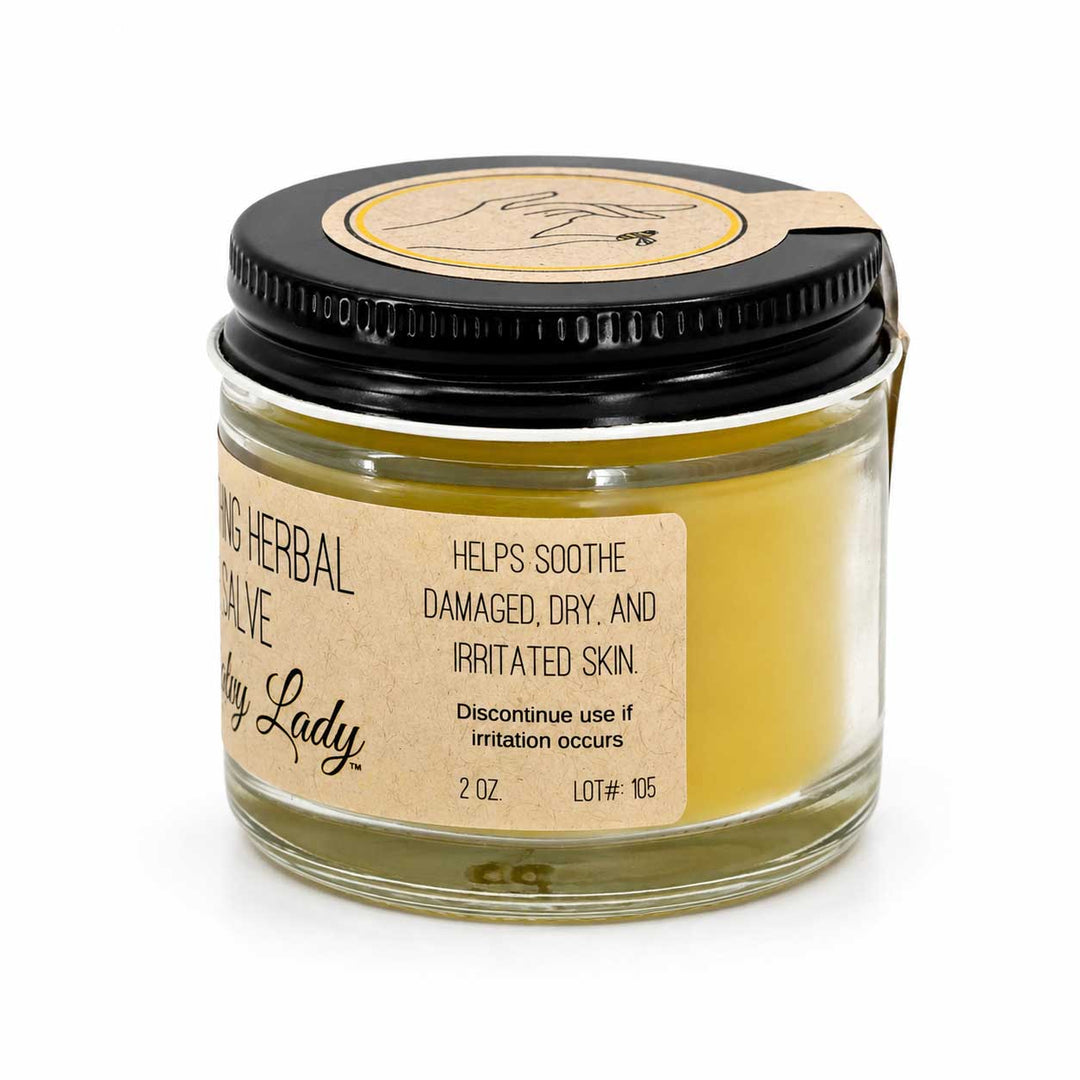 Jar of 'Lady Lady' salve with a black lid on a white background