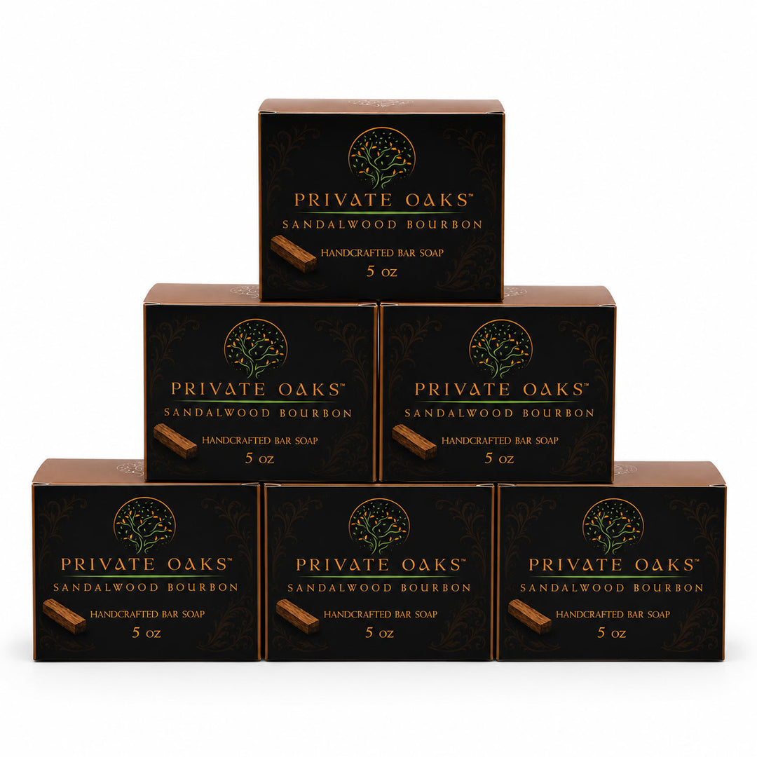 Six boxes of Private Oaks Sandalwood Bourbon Handcrafted Bar Soap arranged in a pyramid stack on a plain white background.