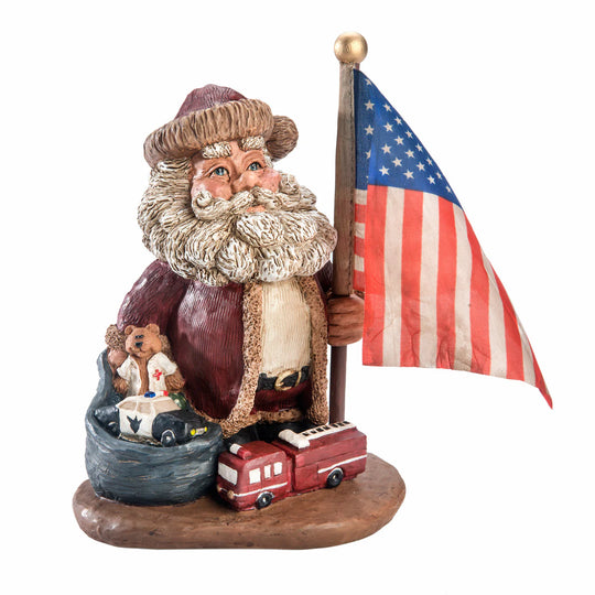Statue of Santa holding an American flag with toys on a white background