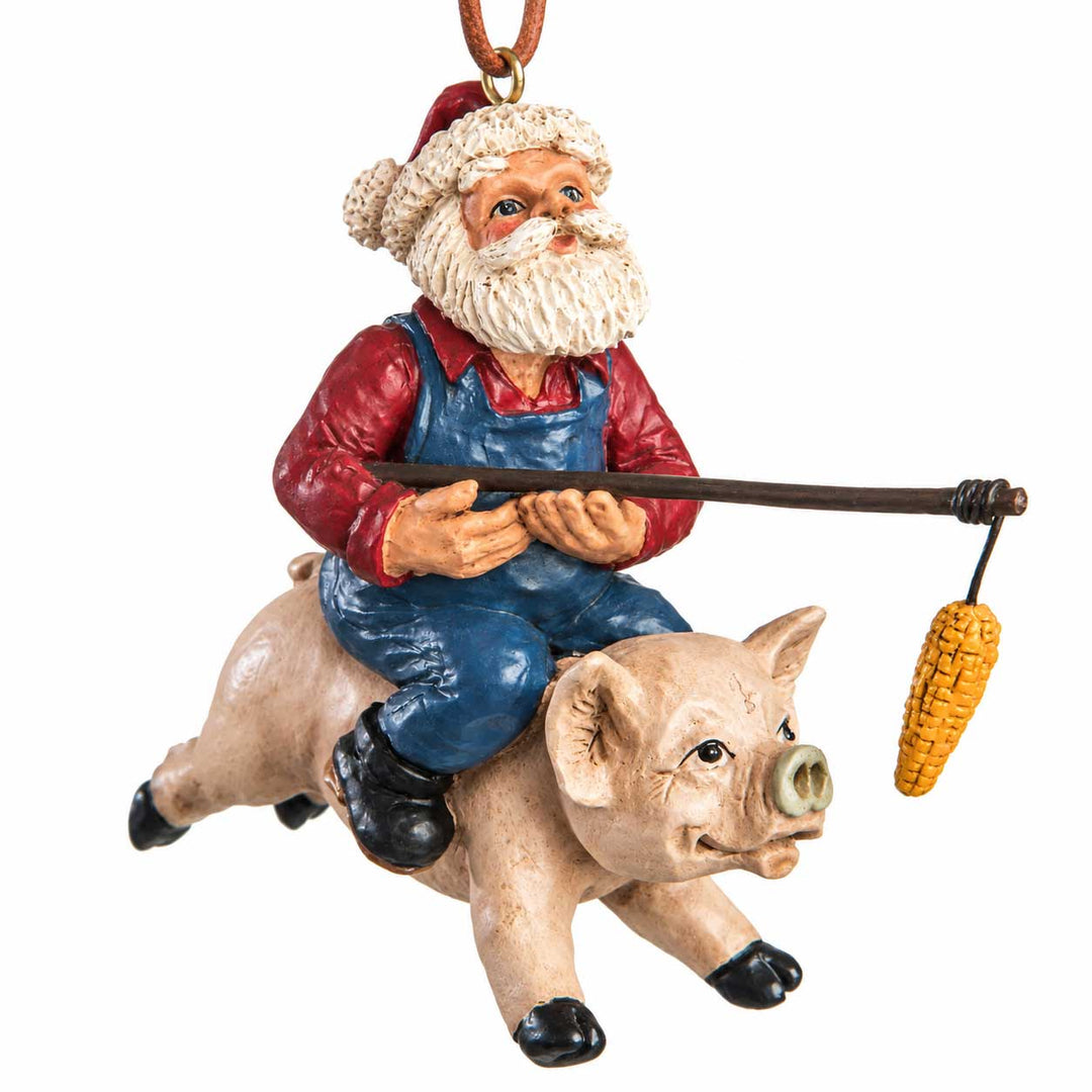 Santa riding a pig ornament