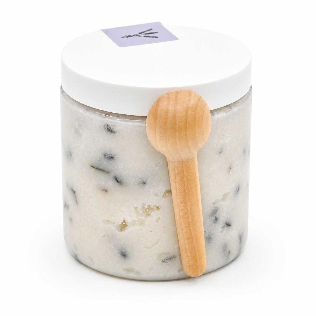 Marble-textured jar with a wooden spoon on a white background