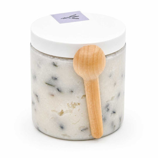 Marble-textured jar with a wooden spoon on a white background