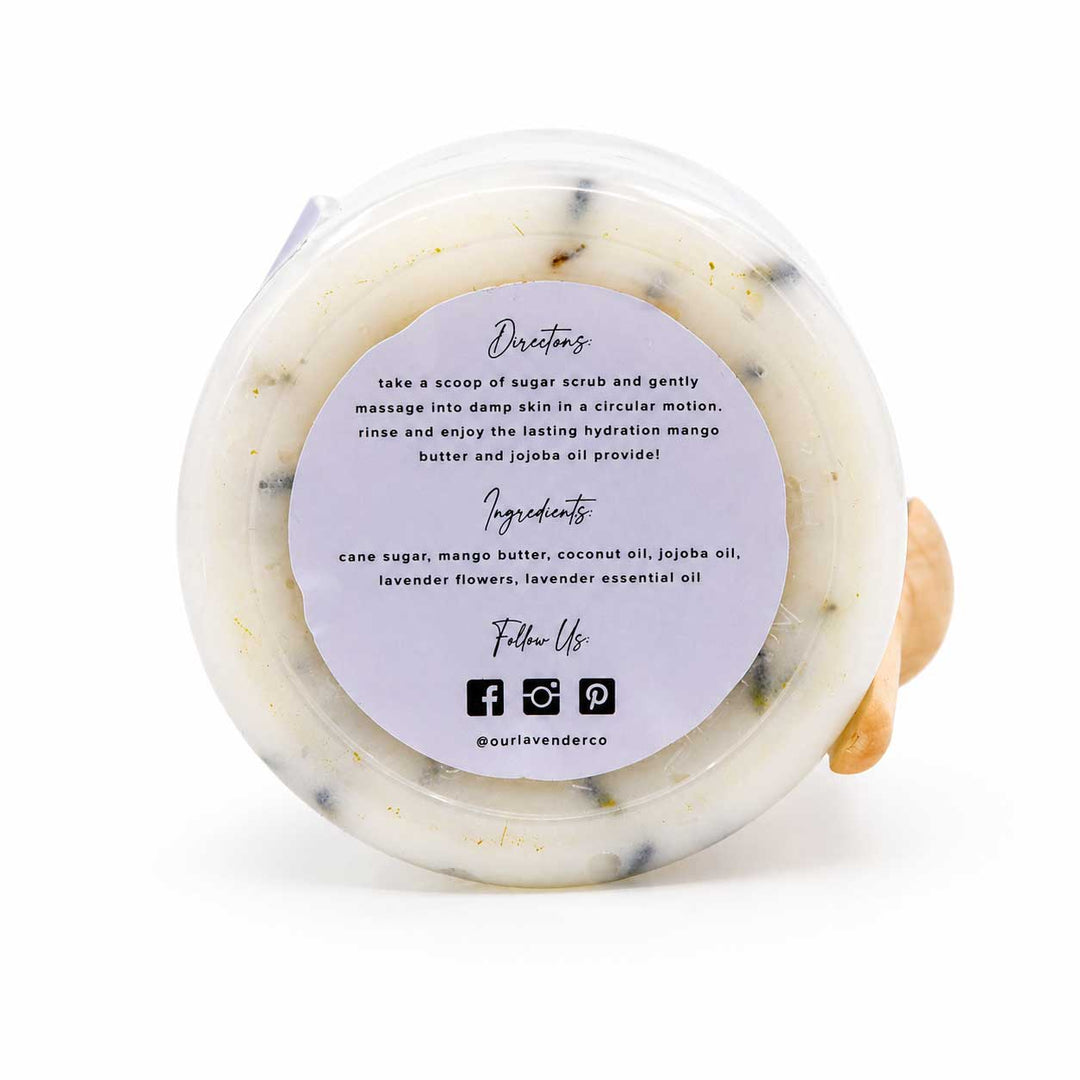 Sugar scrub in a clear container with a label on a white background