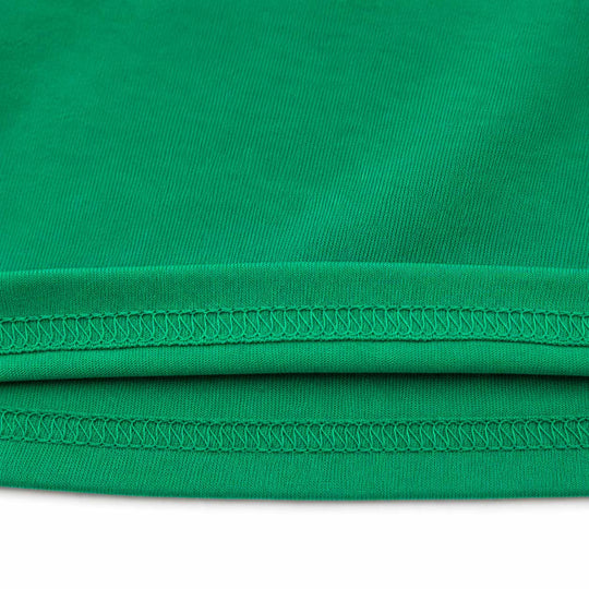 Close-up of a bright green ribbed fabric with double rows of matching green stitching along the hem, shown against a white background.