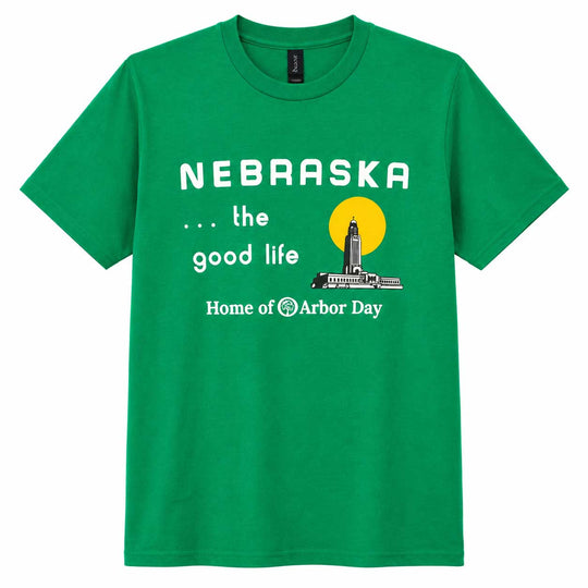 A green short-sleeve crewneck t-shirt featuring a white graphic print that reads 'NEBRASKA .