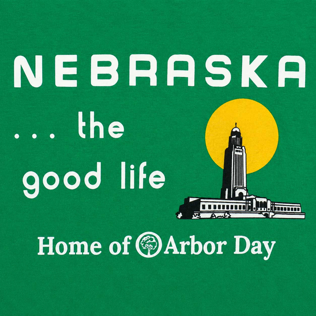 A green graphic print with white text reading 'NEBRASKA .
