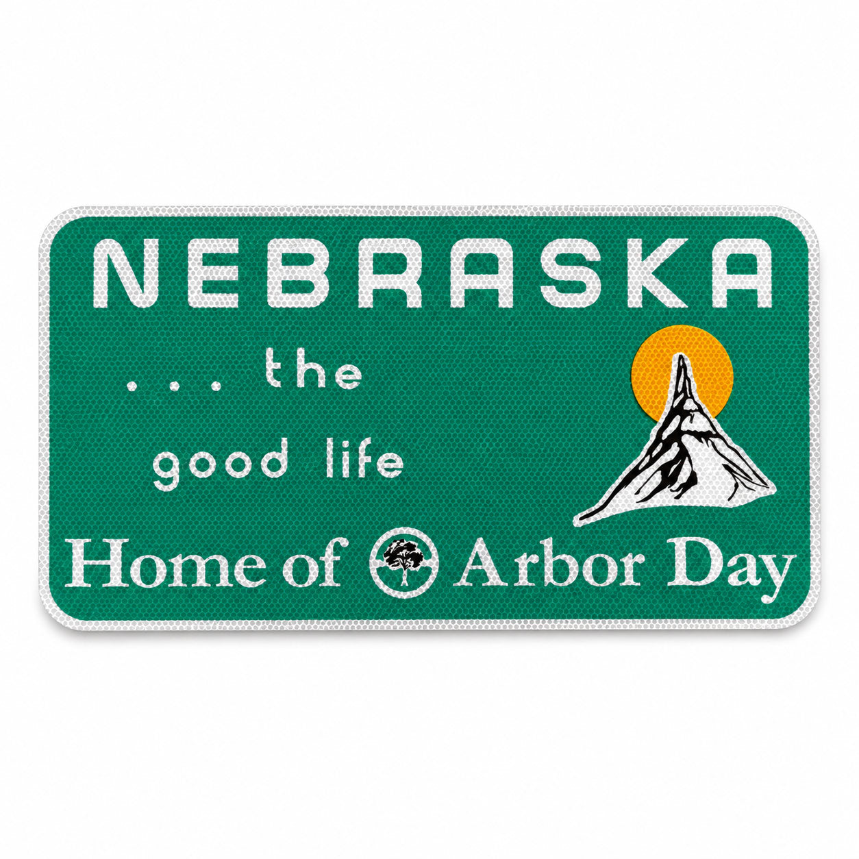A rectangular green Nebraska state-sign style patch or plaque with white text reading “NEBRASKA,” “.
