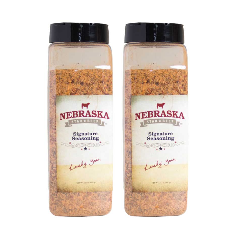 Two bottles of Nebraska Star Beef Signature Seasoning on a white background