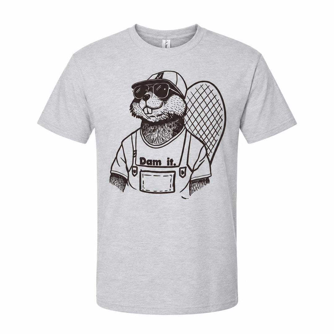 A light heather gray short-sleeve crewneck t-shirt featuring a black line art graphic of a beaver wearing sunglasses, a baseball cap, and overalls with the text 'Dam it.' printed on the front.