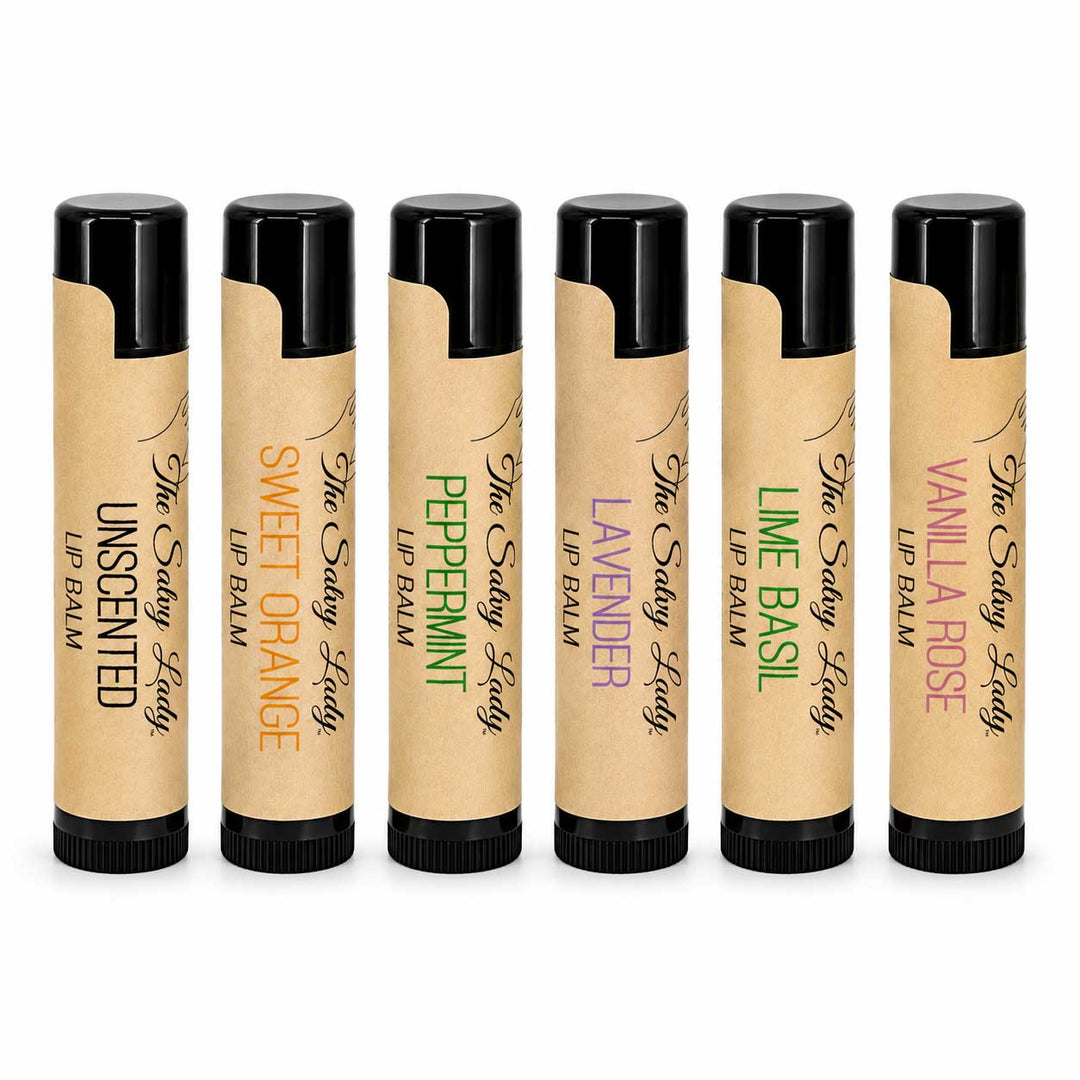 Set of six lip balms with different scents on a white background