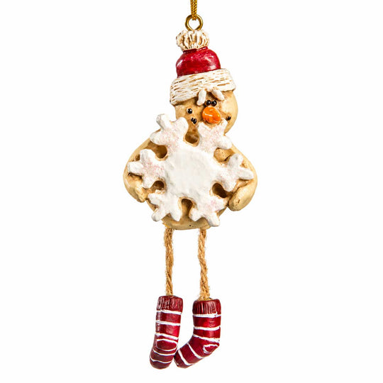 A hanging Christmas ornament shaped like a snowman cookie, wearing a red Santa hat, white scarf, and red-and-white striped socks, shown on a plain white background.