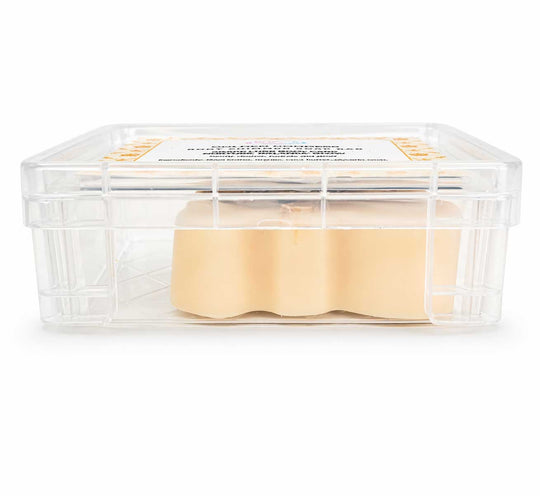 Clear container with beige squares inside on a white background