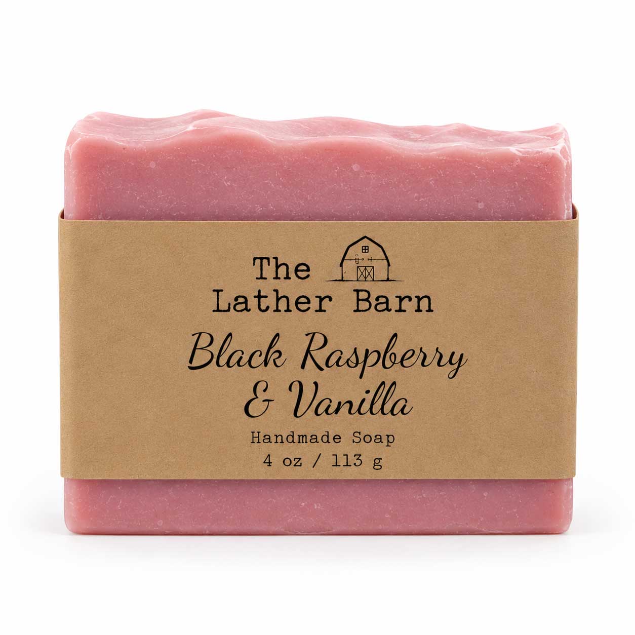 A single bar of handmade soap in pink packaging with a kraft paper label reading 'The Lather Barn Black Raspberry & Vanilla Handmade Soap 4 oz / 113 g' on a white background.