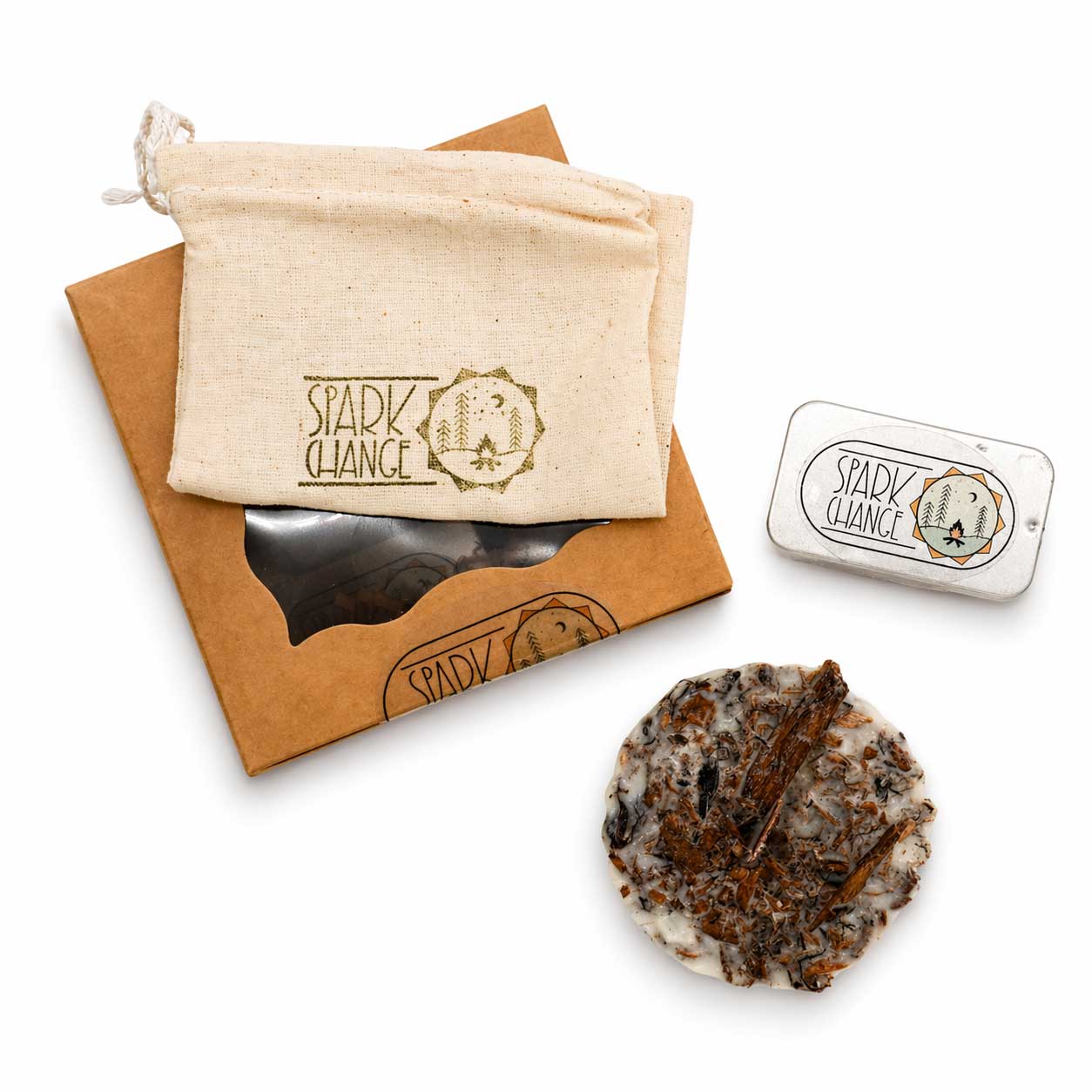 Spark Change product set including a stone, packaging, and branded pouch on a white background