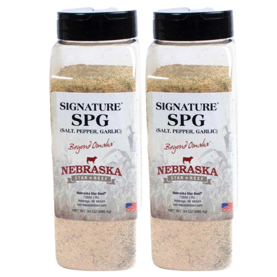 Two bottles of Signature SPG seasoning with Nebraska Star & Beef branding on a white background.