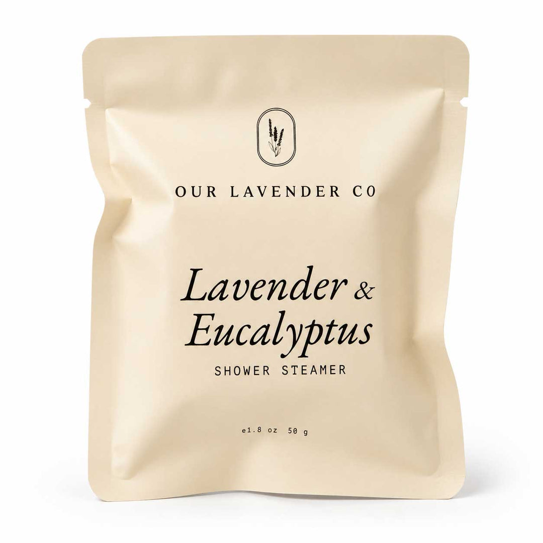 Beige packaging of Lavender & Eucalyptus Shower Steamer from Our Lavender Co on a white background