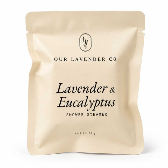 Beige packaging of Lavender & Eucalyptus Shower Steamer from Our Lavender Co on a white background