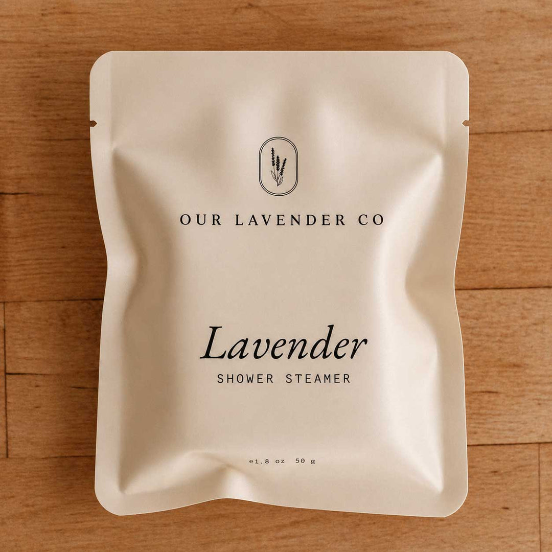 Lavender shower steamer packaging from Our Lavender Co on a wooden surface