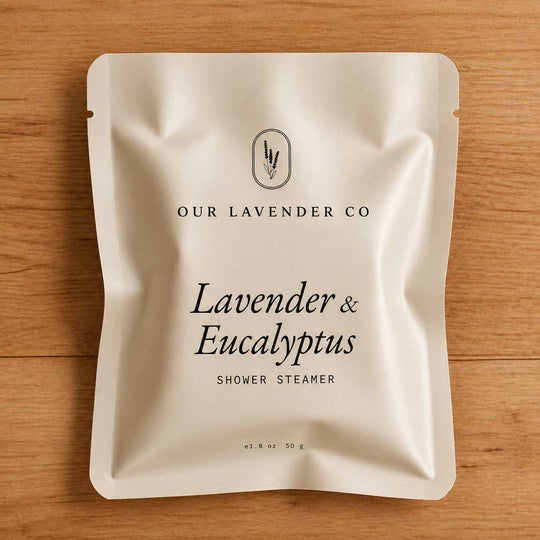 Lavender & Eucalyptus shower steamer packaging on a wooden surface