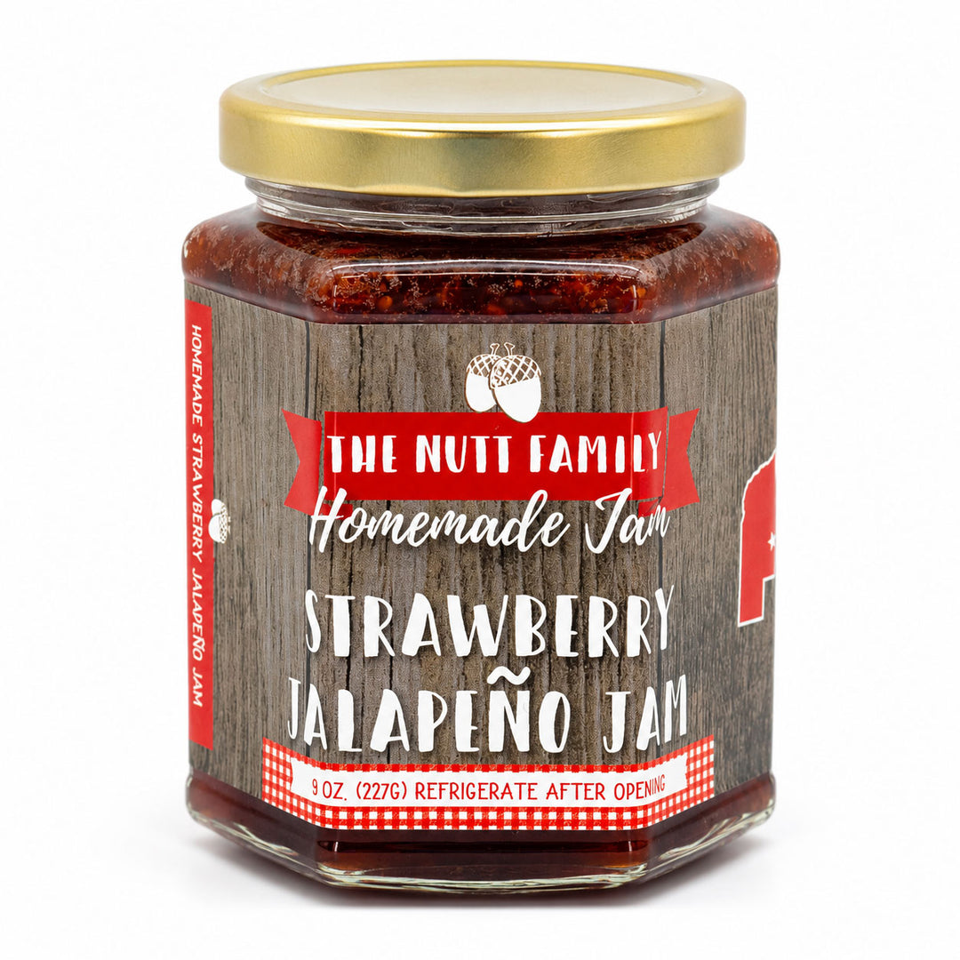 Jar of strawberry jalapeño jam with a wooden-textured label on a white background