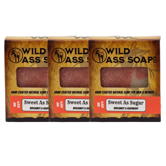 Three bars of Wild Ass Soap packaging on a white background