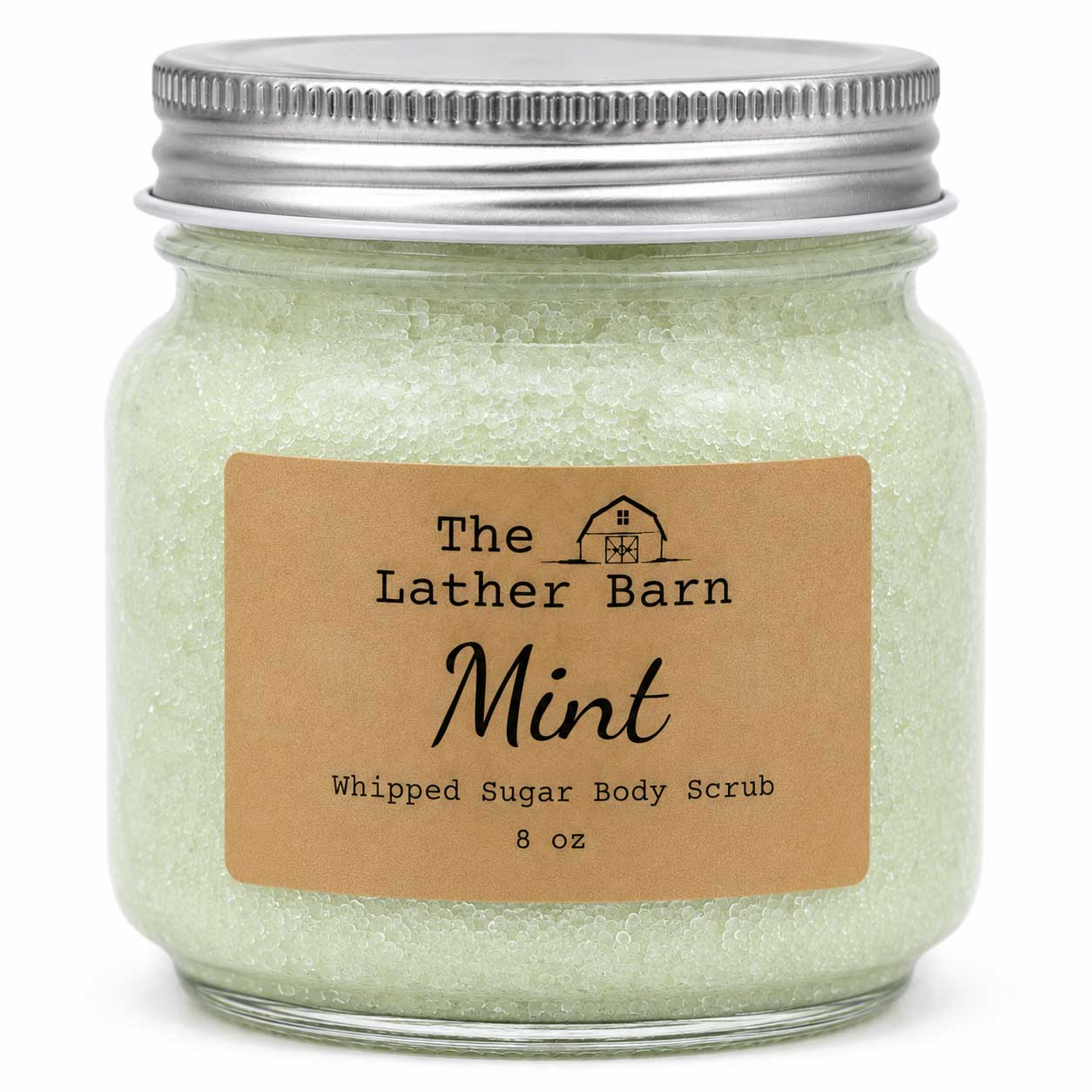 A 8 oz glass jar of The Lather Barn Mint Whipped Sugar Body Scrub, filled with pale mint green scrub and sealed with a silver metal lid, featuring a brown kraft paper label.