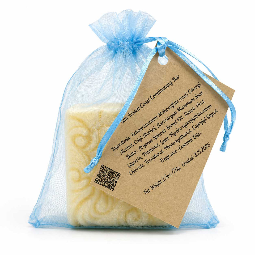 Bar of soap in a blue organza bag with a brown label on a white background