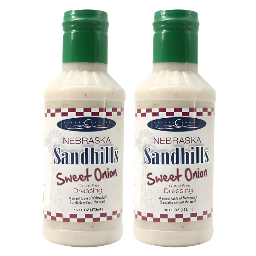 Two bottles of Nebraska Sandhills Sweet Onion Dressing on a white background