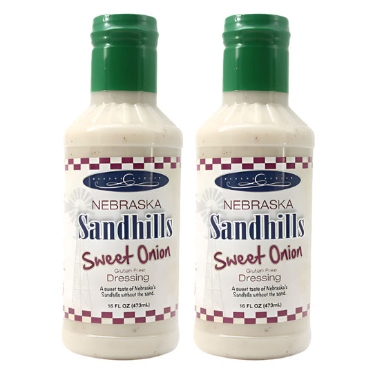 Two bottles of Nebraska Sandhills Sweet Onion Dressing on a white background