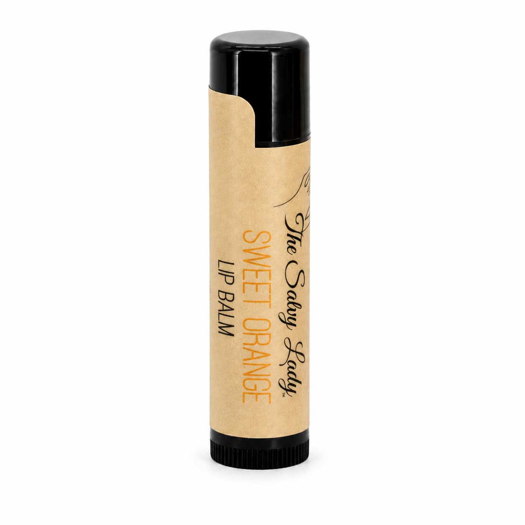 Lip balm with a black cap and beige body on a white background