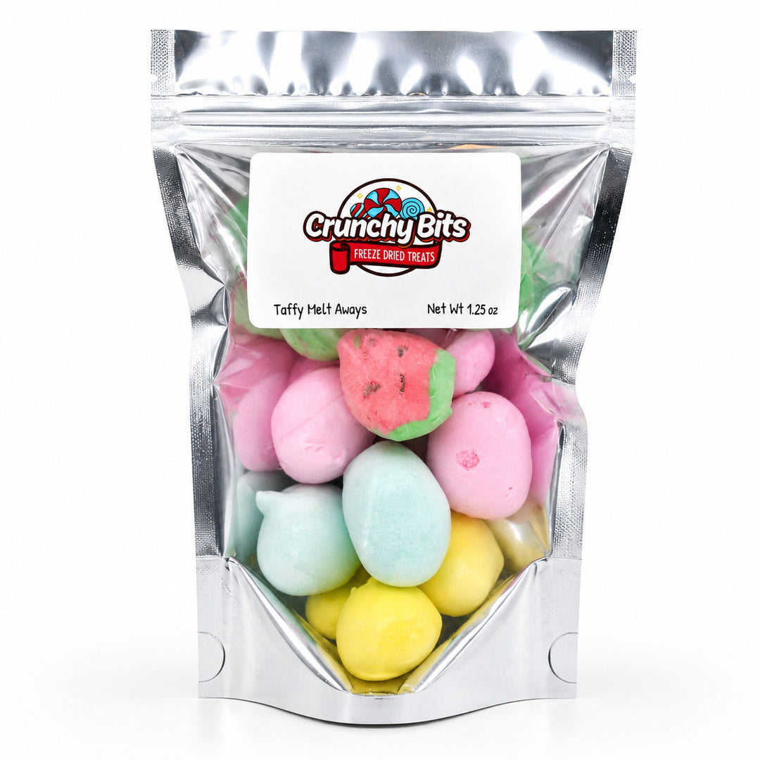 Packaged treats with colorful taffy meltaways and 'Crunchy Bits' branding.