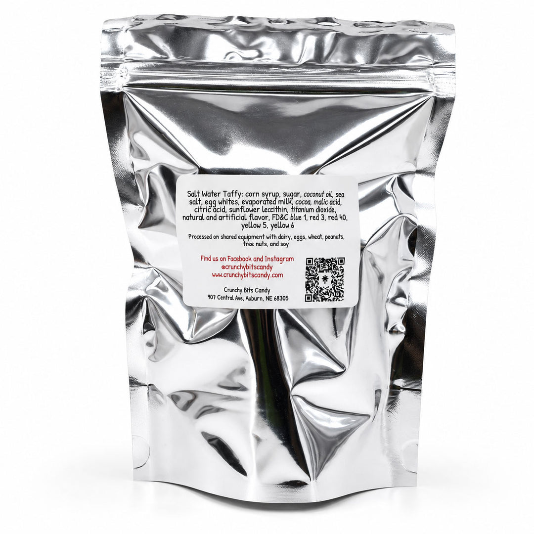 Silver foil packaging with text and a QR code on a white background