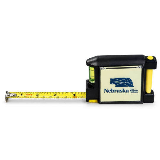 A Nebraska tape measure with a yellow measuring tape extended to the left, set against a plain white background.