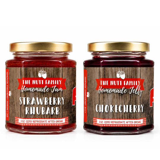 Two jars of homemade jam and jelly with labels on a white background