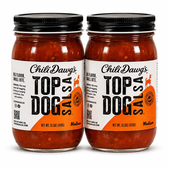 Two glass jars of Chili Dawg's Top Dog Salsa side by side on a white background, featuring white and orange labels with black text and black metal lids.