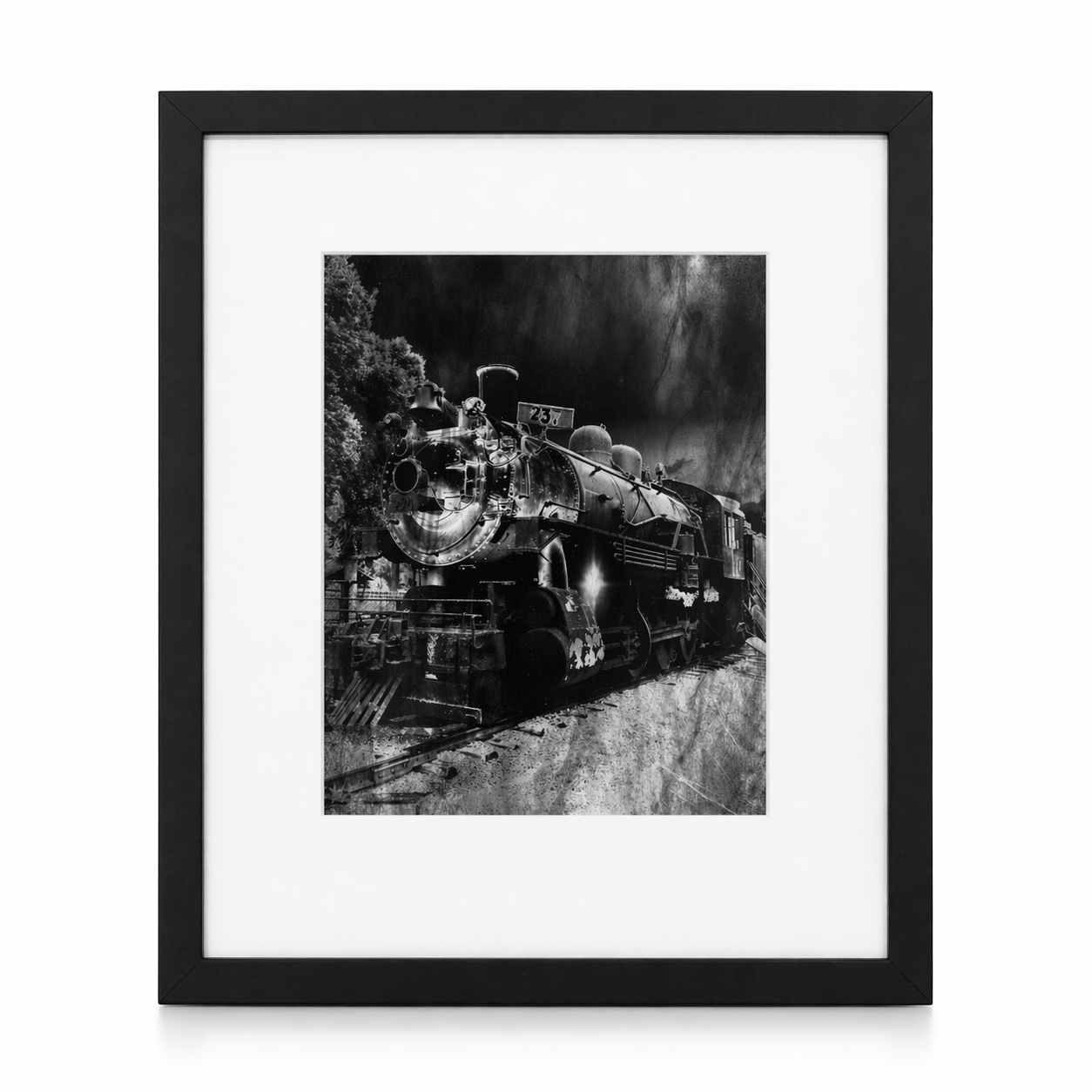 Framed black and white photograph of a vintage steam locomotive.