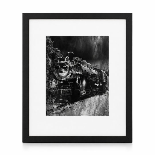 Framed black and white photograph of a vintage steam locomotive.