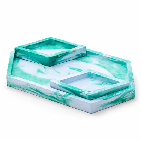 Marble-patterned tray with two smaller trays on a white background